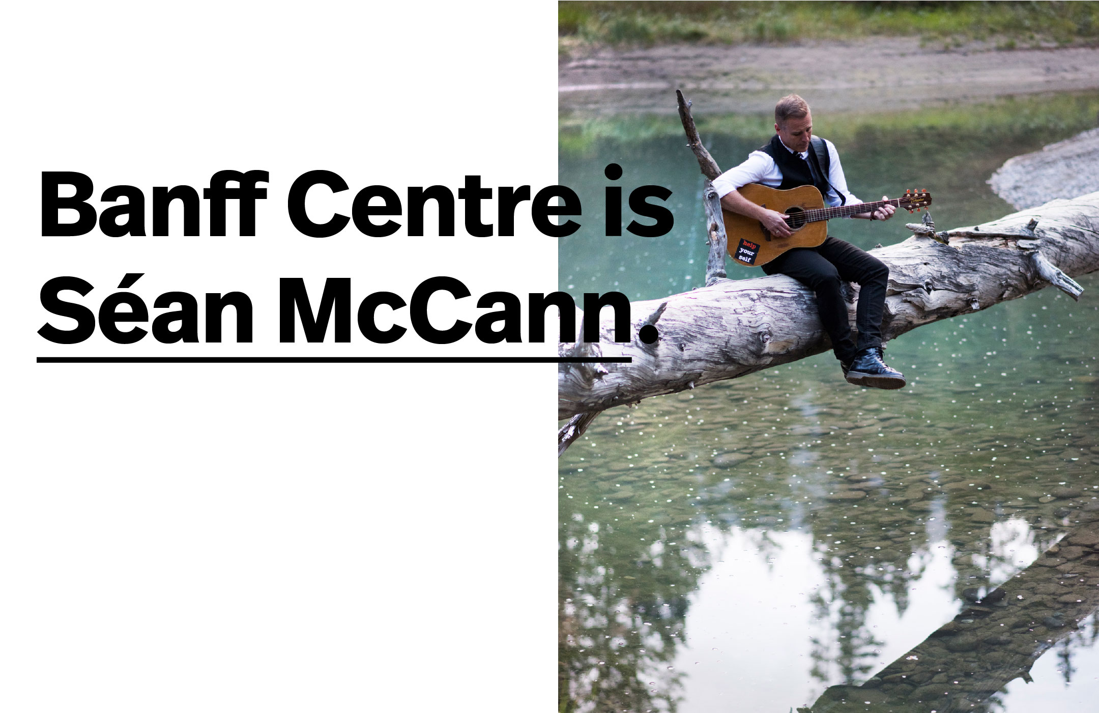 Musician Sean McCann sitting in nature tuning his guitar. 