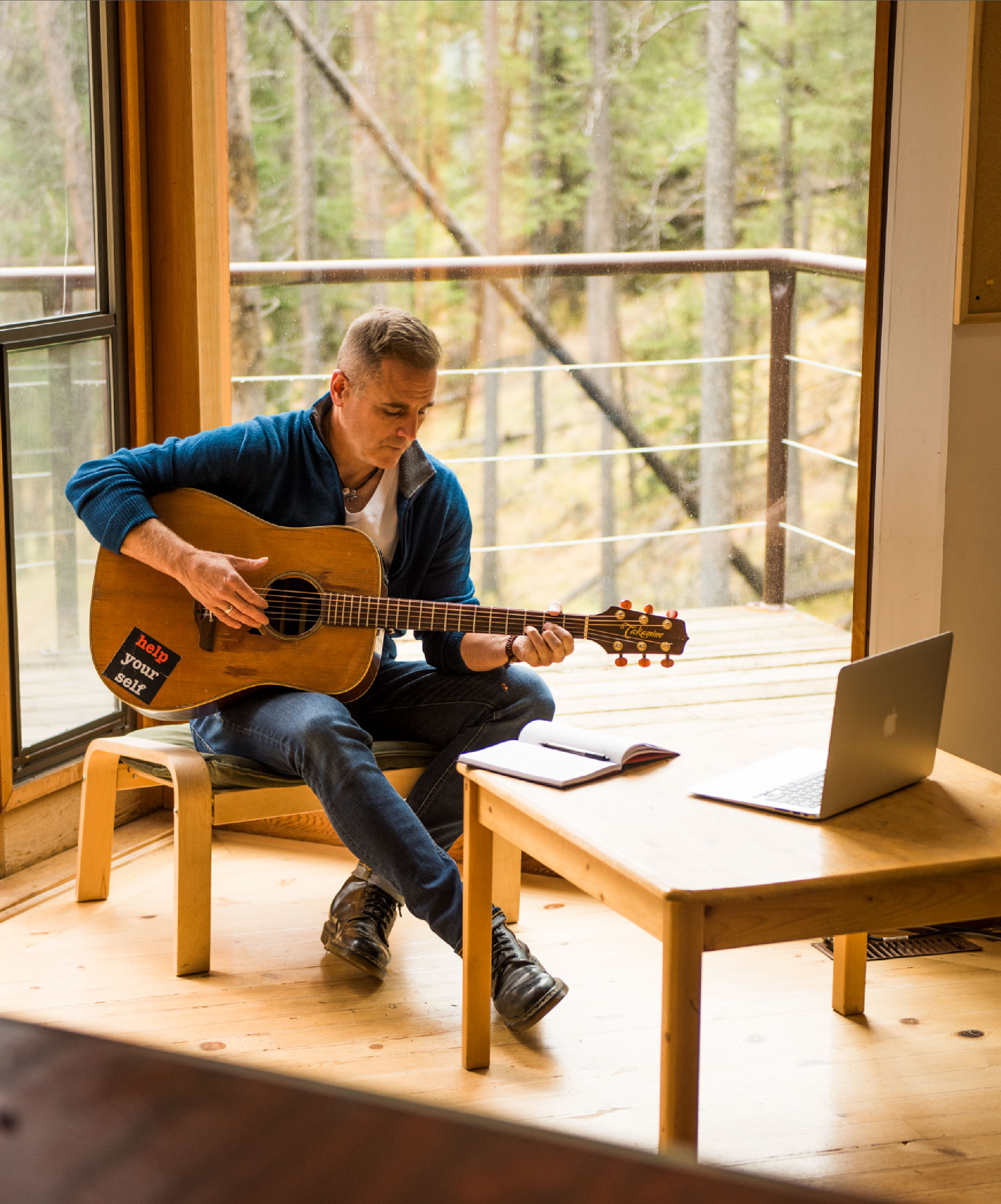 Sean McCann writing music in a studio.