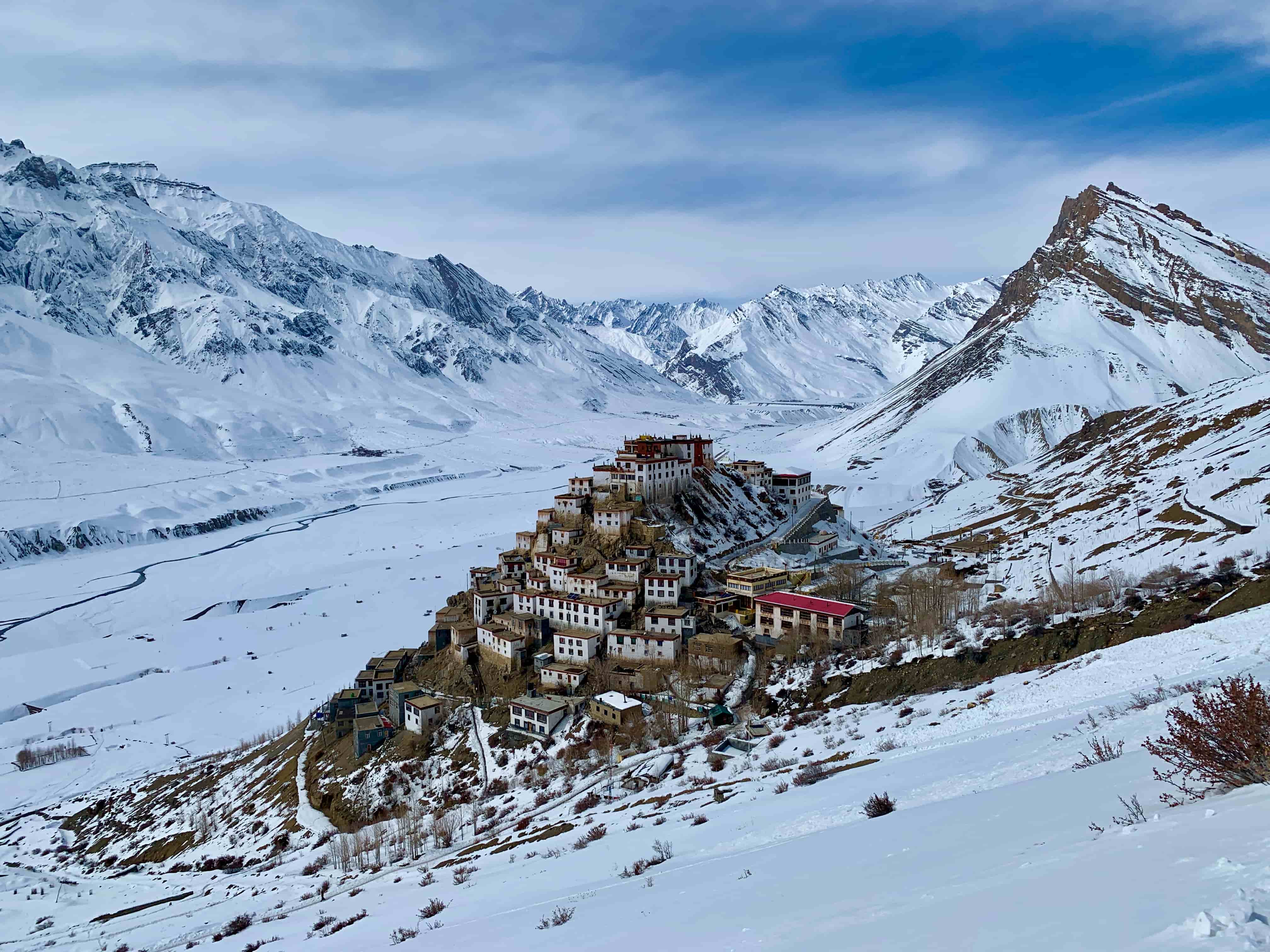 A monastery in snowy mountains.