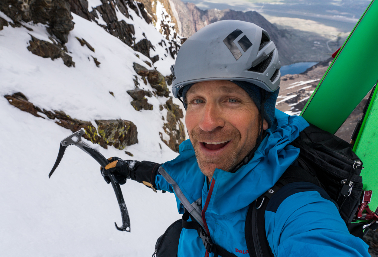 Photographer Christian Pondella takes a selfie as he climbs a mountain.