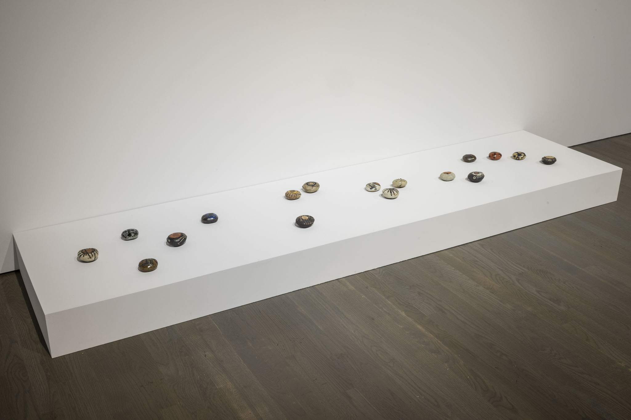 Installation view of Elliptical Lineages, Walter Phillips Gallery, Banff Centre for Arts and Creativity, 2025. Wayne Ngan, Skipping Rocks, Testing Pebbles, 2010, courtesy of Wayne Ngan Estate. Photo: Rita Taylor.