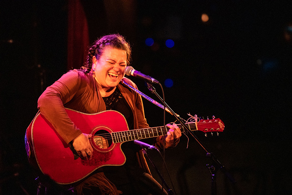 Miranda Currie is pictured singing and playing guitar during a performance at Banff Centre's 2019 Indigenous Arts Singer