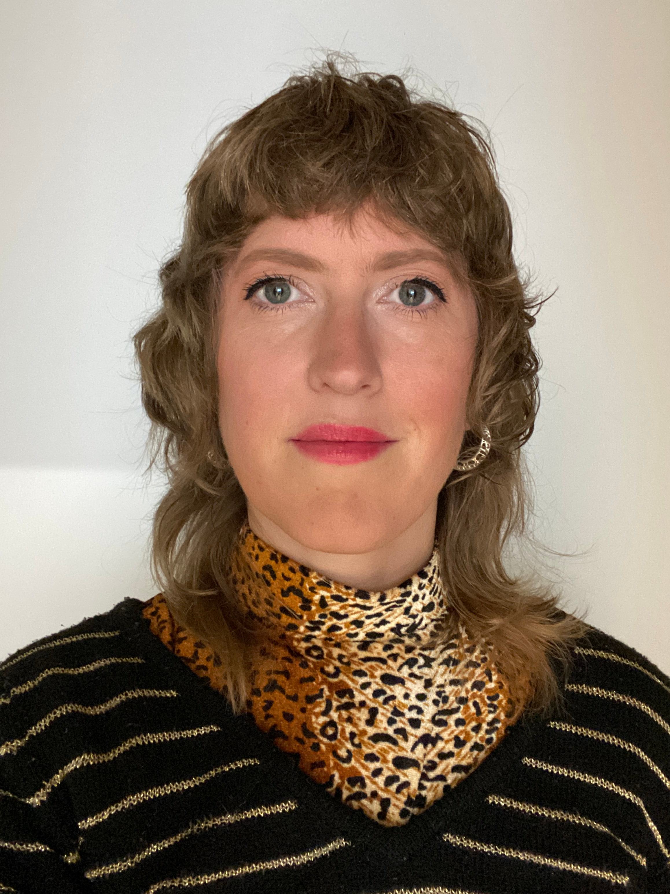 Woman with modern haircut confidently looking into the camera