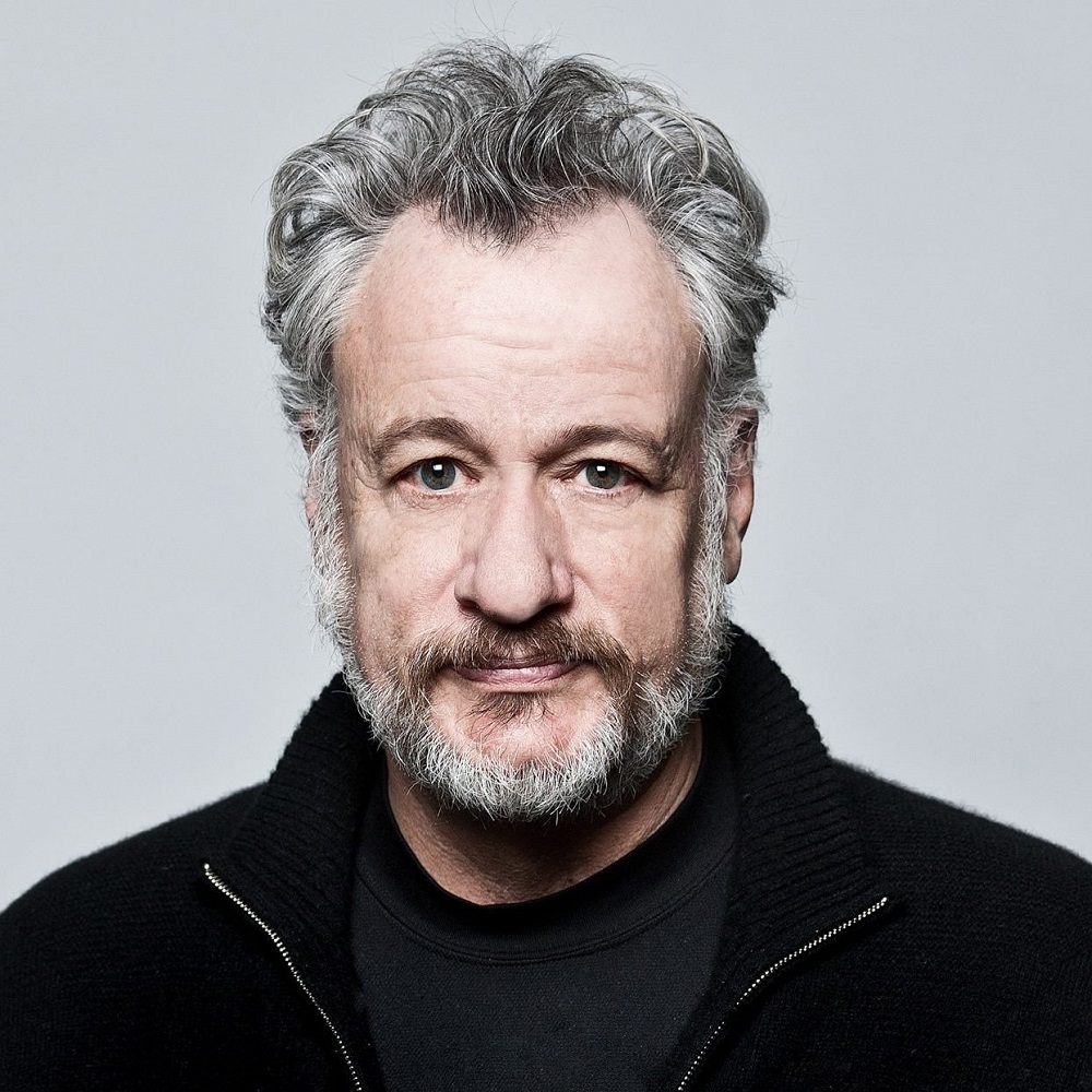 Headshot of John de Lanci