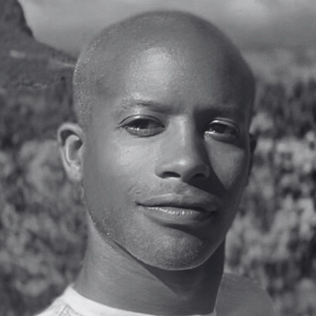 Close up black and white photo of man in nature