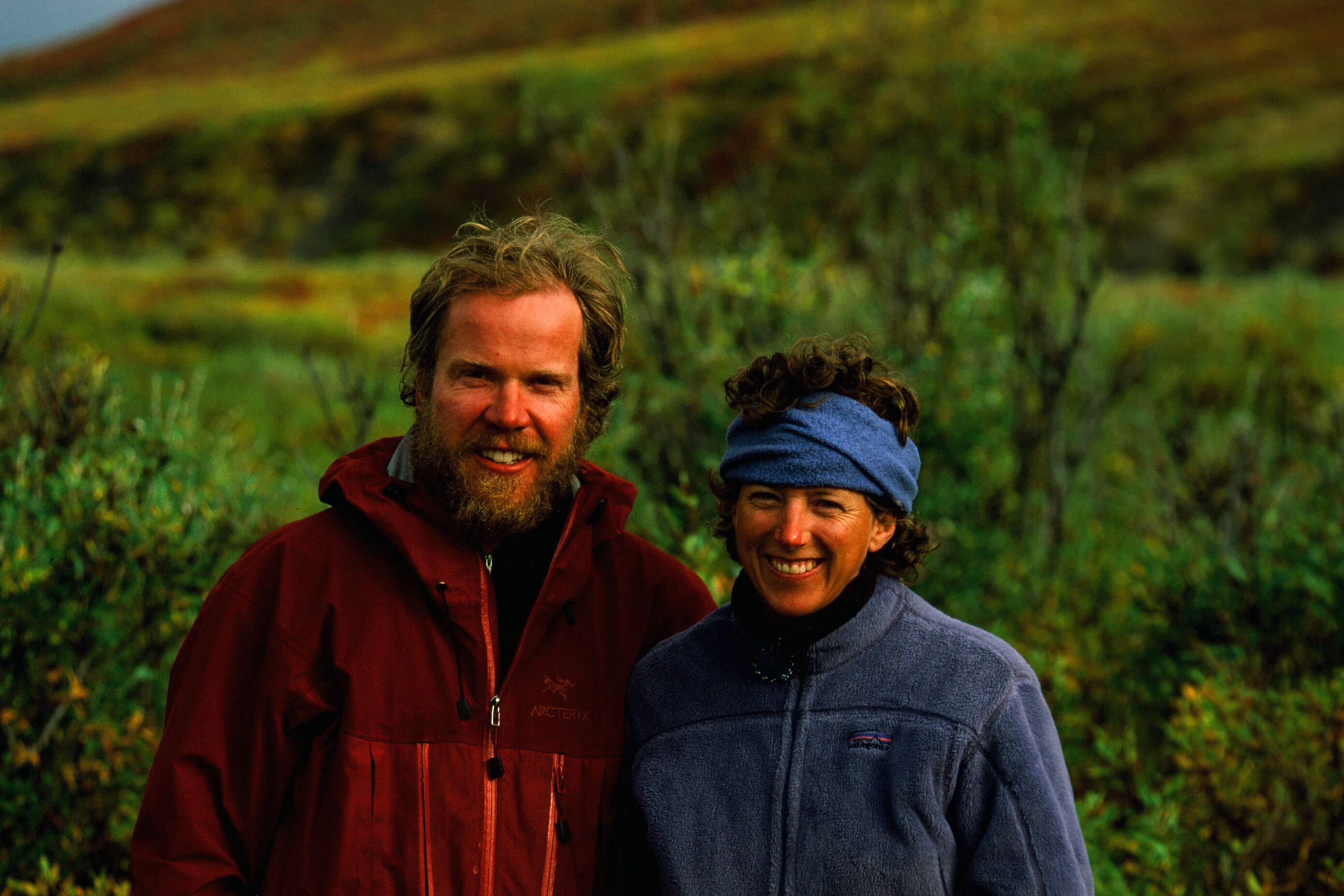 Karsten and Leanne smiling with trees behind