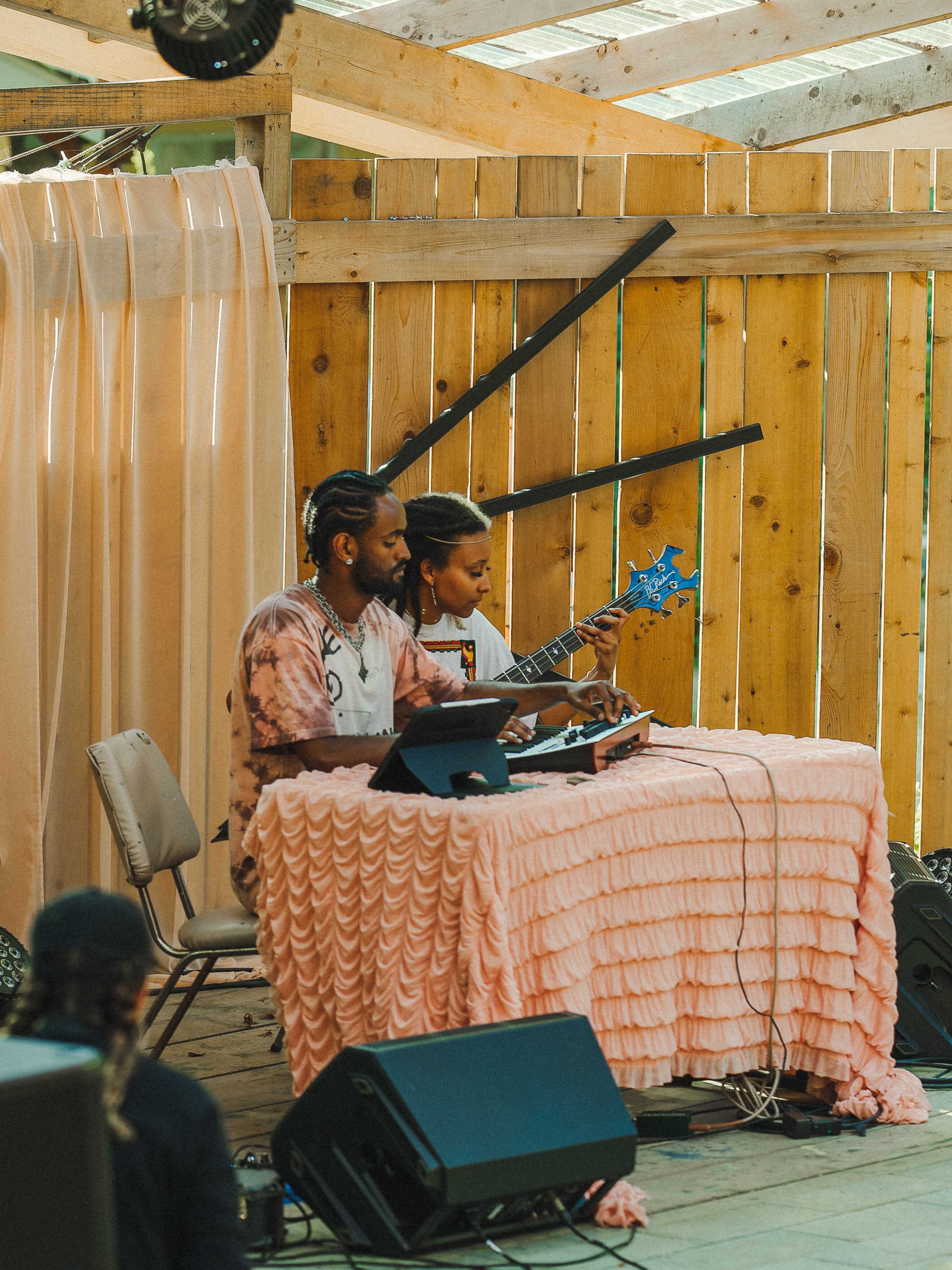 Woman and Man sitting at table with instruments
