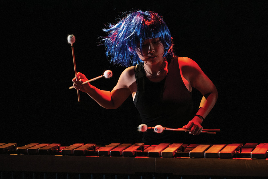 Banff Musicians in Residence at Banff Centre for Arts and Creativity A musician in a blue wig plays a percussion instrument