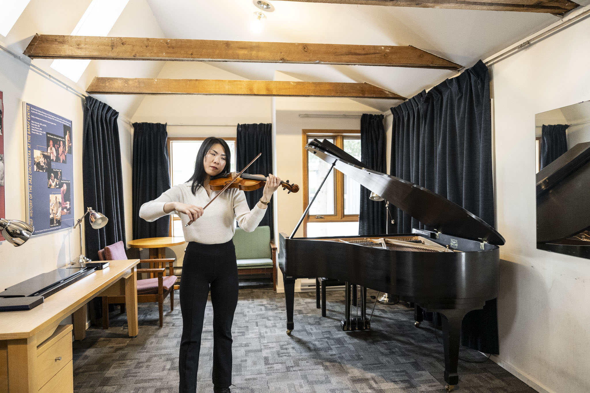 A violinist inside one of the Music Huts at Banff Centre. Photo Credit: Rita Taylor