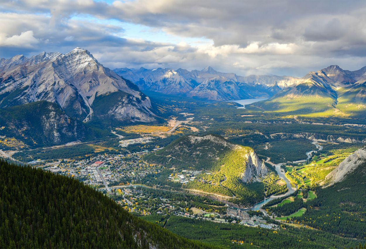 Aerial view of the town of banff in summer with green grass.