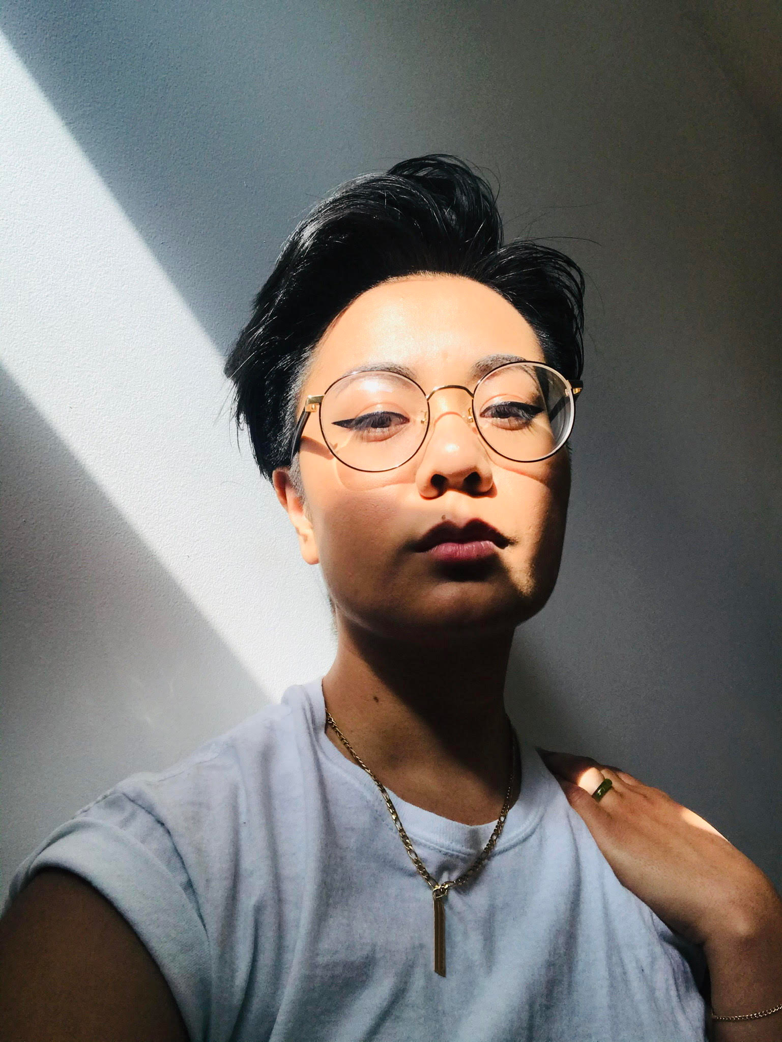 Woman with short hair staring directly at camera