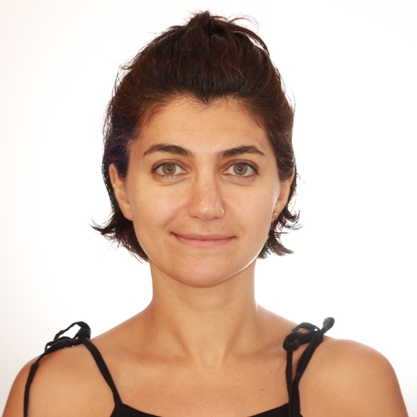 Woman with short brown hair looking into the camera