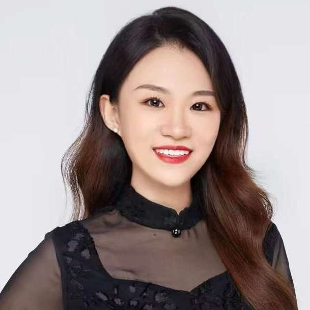 Woman smiling at camera wearing a black shirt