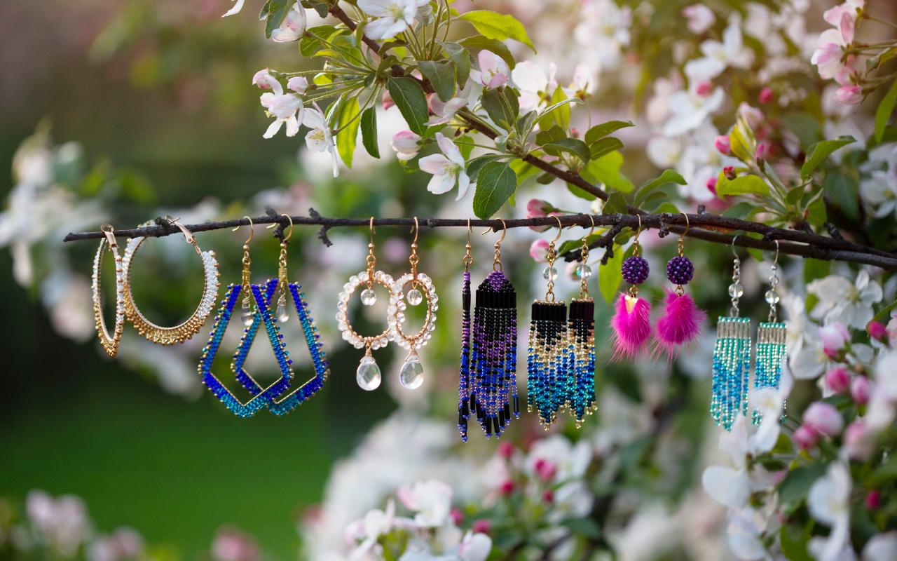 Beaded earrings hanging from a branch