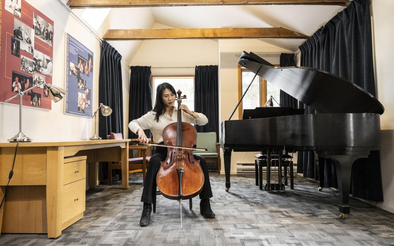 A cellist inside one of the Music Huts at Banff Centre. Photo Credit: Rita Taylor