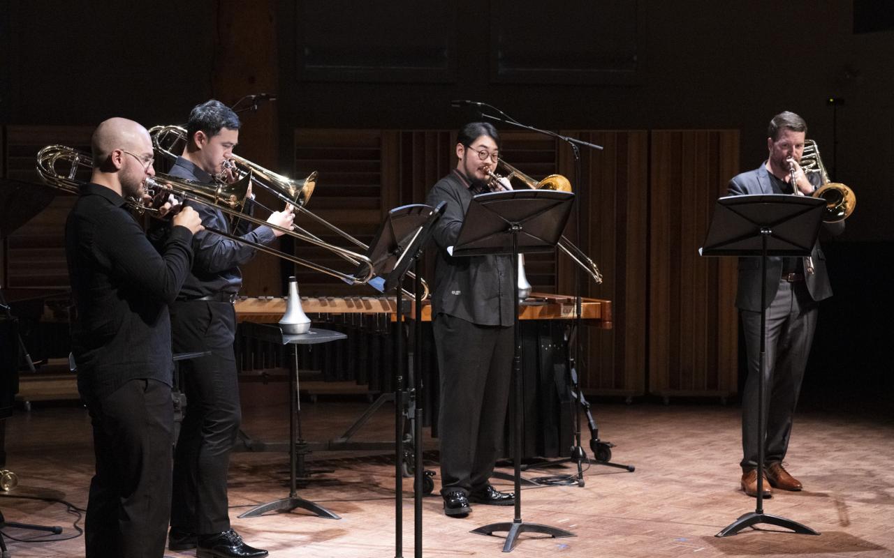Interplay Chamber Music Concert, 2024. L to R: Lee Allen (alto trombone), Jihong Son (tenor trombone), Charlie Cao (tenor trombone), and  DJ Combs (bass trombone). Photo by Abigaile Edwards.