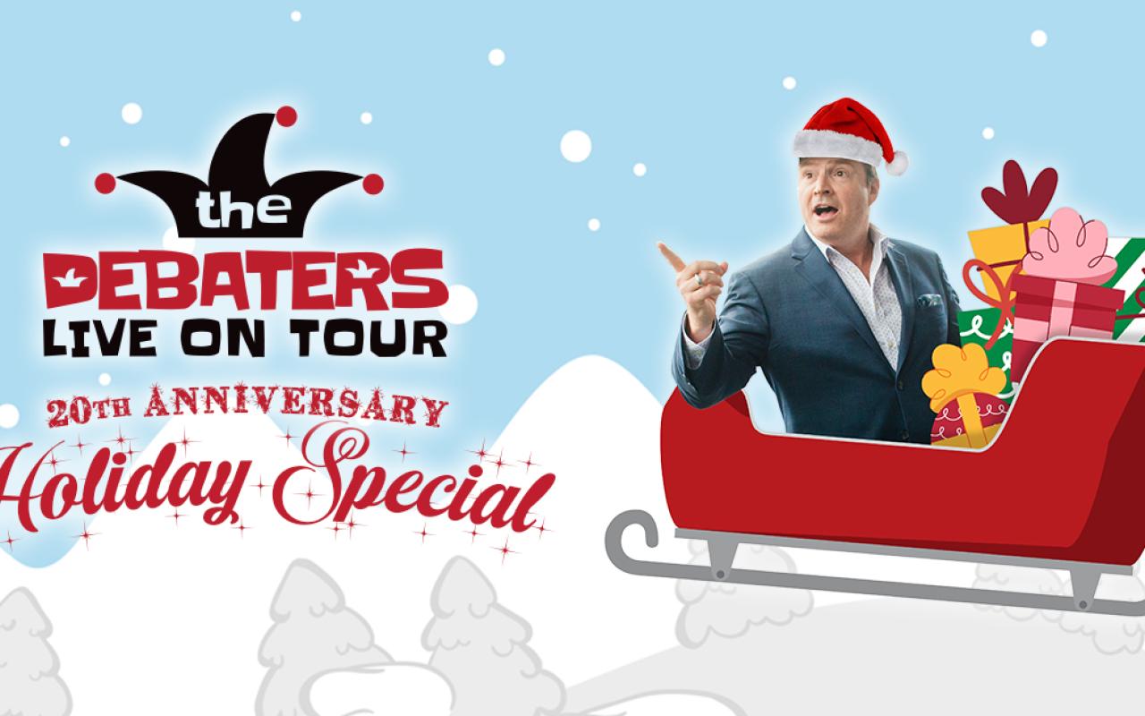 Steve Patterson sitting in a sleigh pointing to the title The Debaters Live on Tour 20th Anniversary Holiday Special
