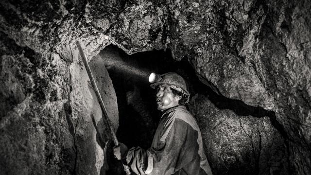 A miner from Potosí, Bolivia, working inside the mine to extract coal
