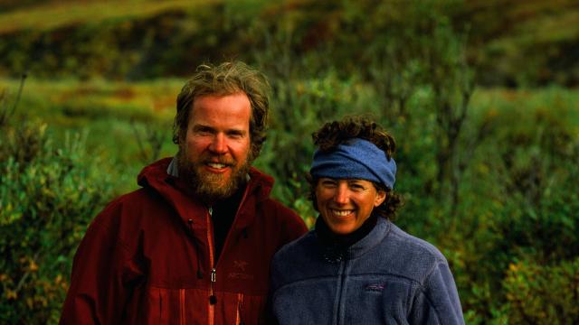 Karsten and Leanne smiling with trees behind