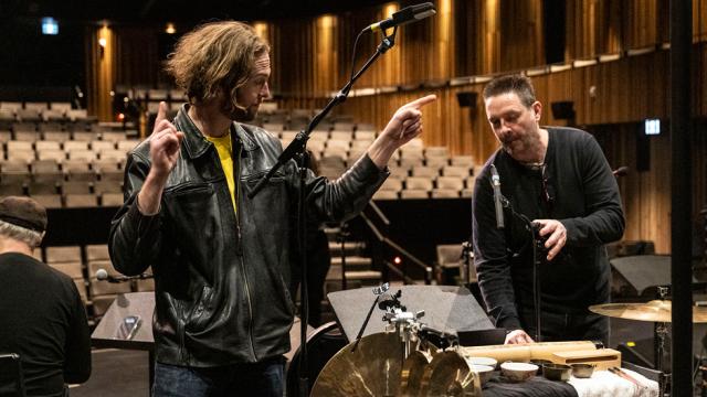 Audio engineers working on a stage