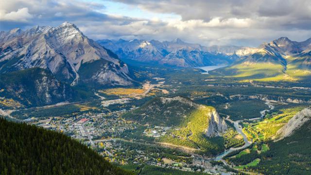 Aerial view of the town of banff in summer with green grass.