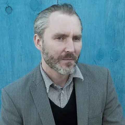 Headshot of Reid Anderson