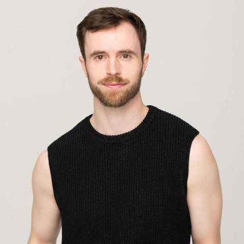 Male dancer in a black vest 