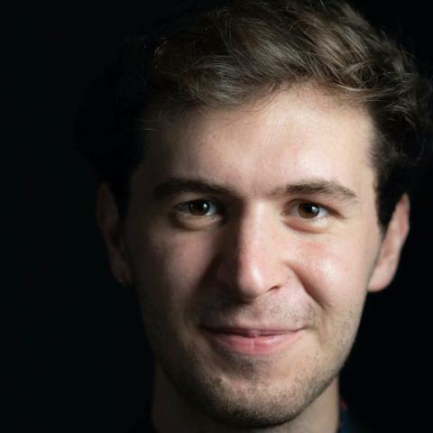 Close up shot of man smiling directly at camera