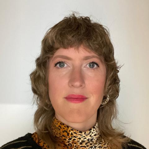 Woman with modern haircut confidently looking into the camera