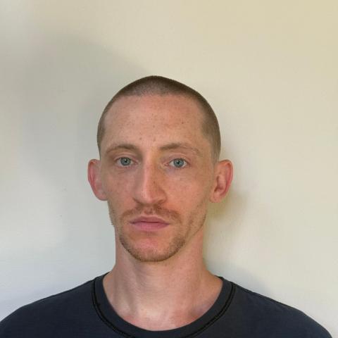 White male very thin and in black shirt
