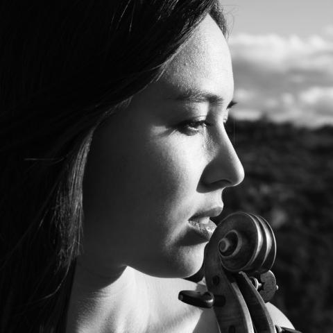 side view of Claudia with viola