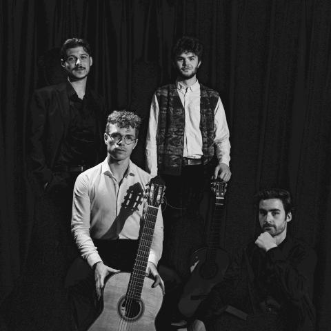 Members of Quartet Malamatina in black and white with one of the members holding a guitar