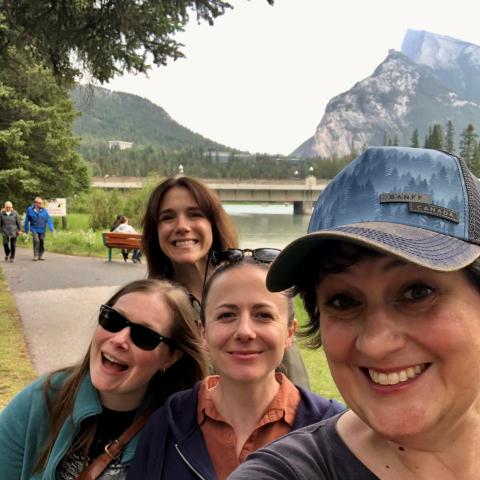 The members of the Silvana Quartet are outdoors taking a selfie in Banff National Park