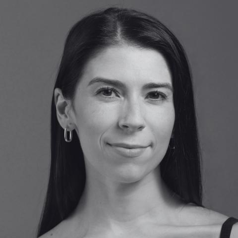 Black and white photo of woman with long hair over shoulders