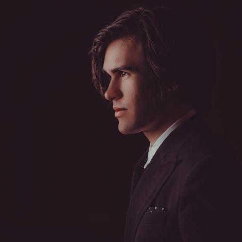 close up of man in suit looking off to the side