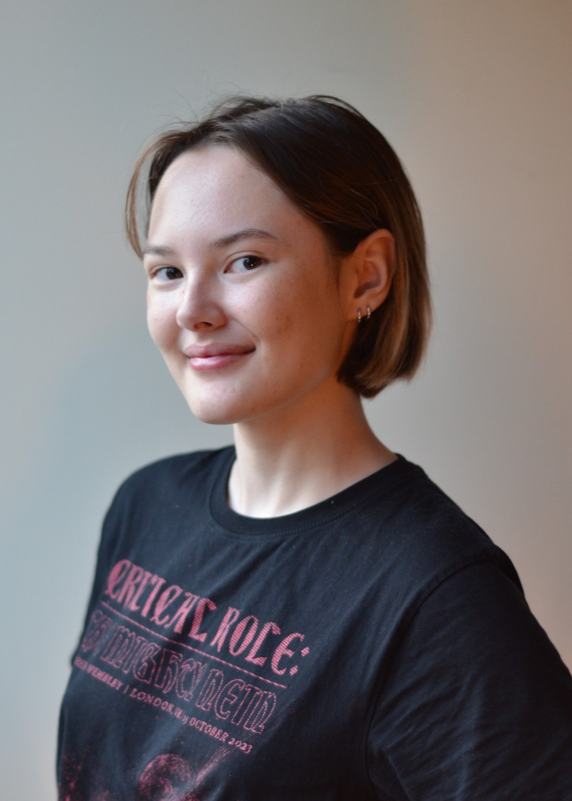 Woman with short bob smiling at the camera